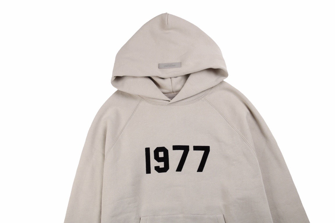 FEAR OF GOD ESSENTIALS "1977" HOODIE STONE GREY